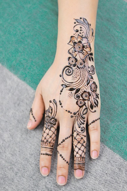 tattoo artist hands drawing custom design sketchbook